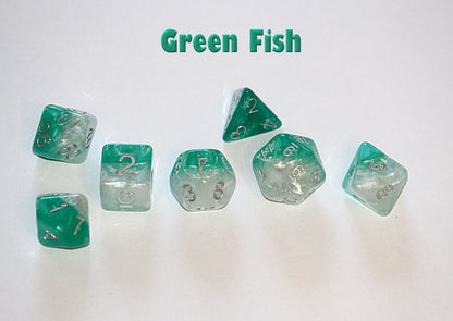 A set of seven green and white marbled polyhedral dice scattered on a white surface, with "Green Fish" text above.