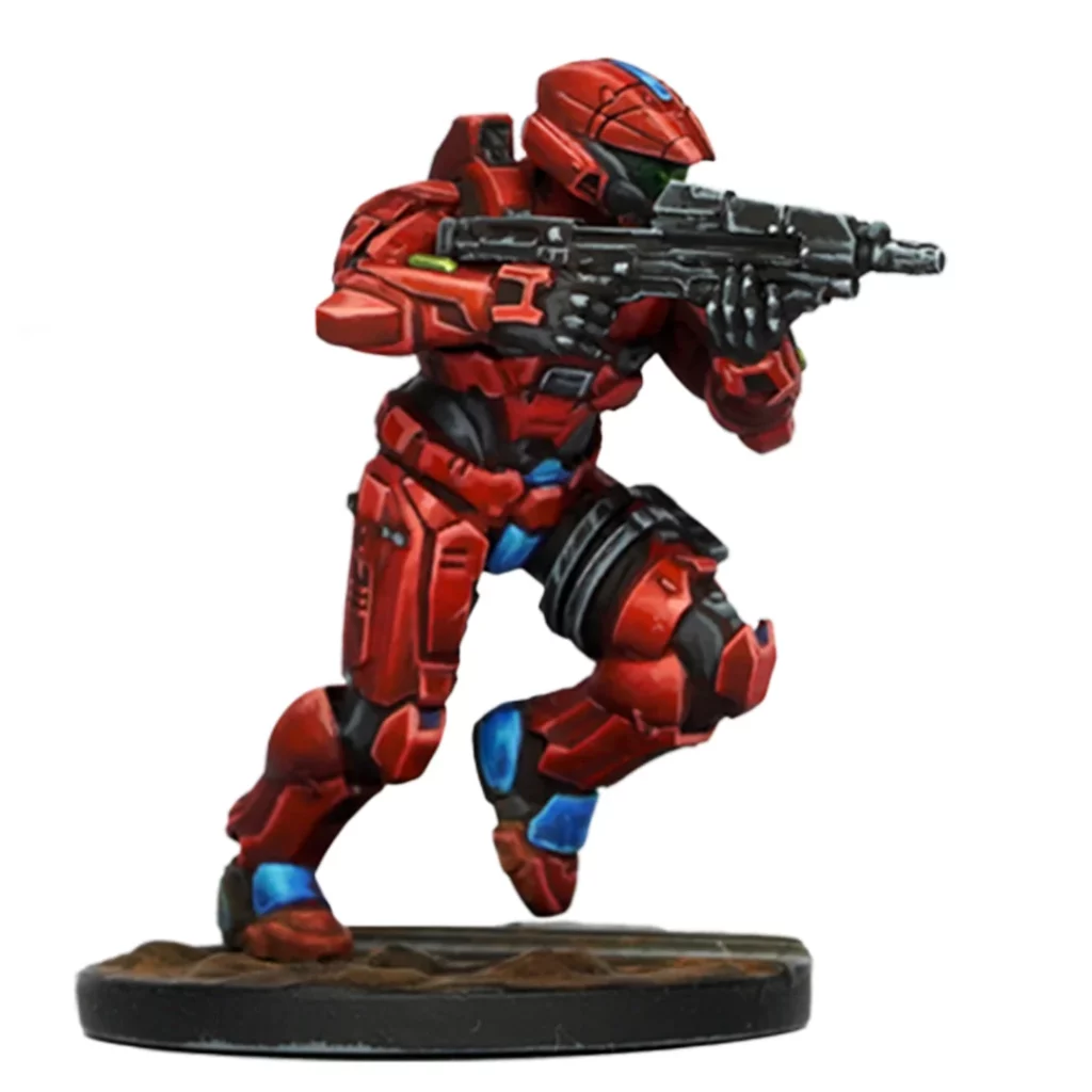 Red armored Halo Spartan miniature runs forward, aiming an assault rifle