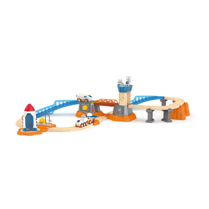Space-themed wooden toy track set with rocket launch pad, control tower, and elevated train paths