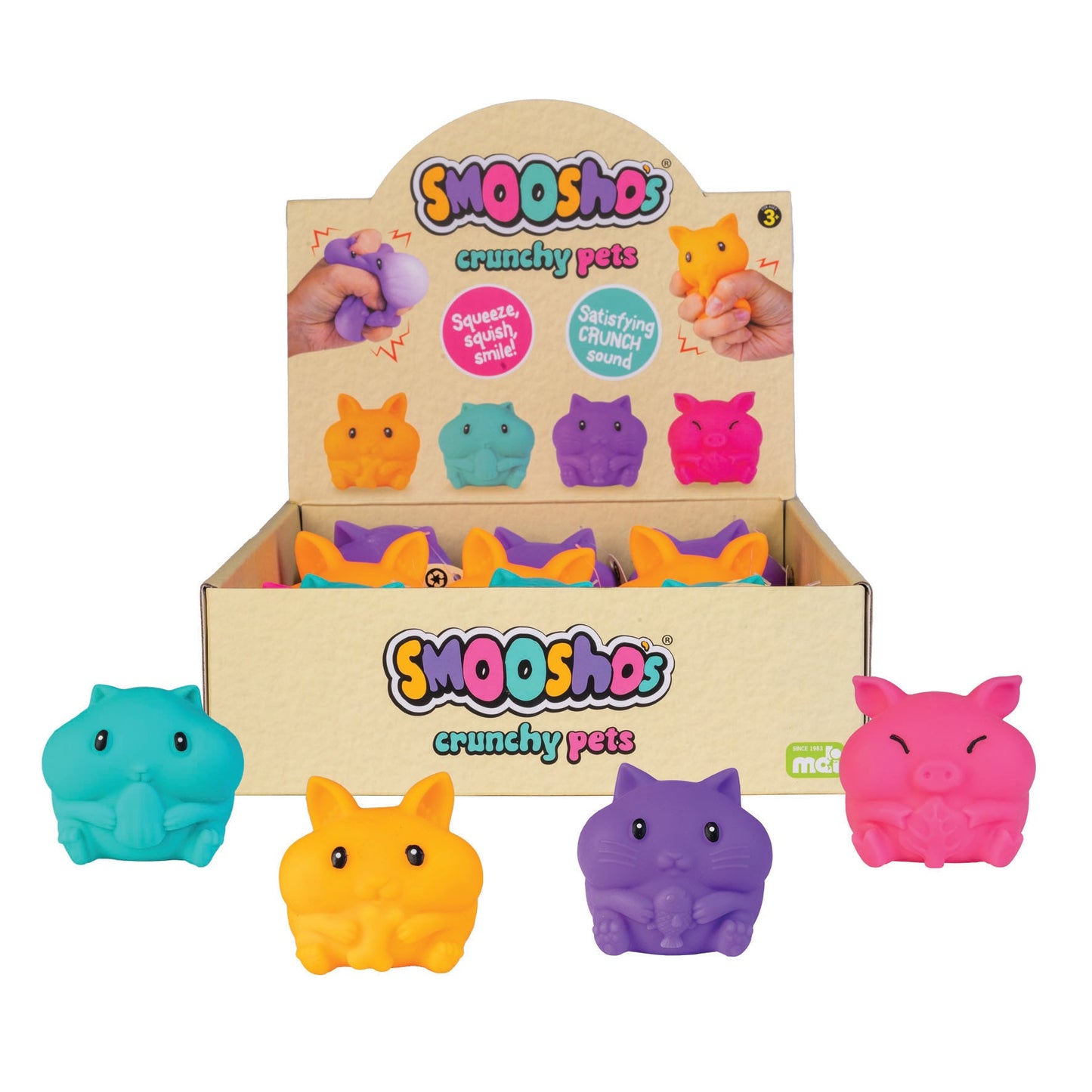 Display box holding colorful Smooshos Crunchy Pets squeeze toys: orange bunny, blue hamster, purple cat, and pink pig