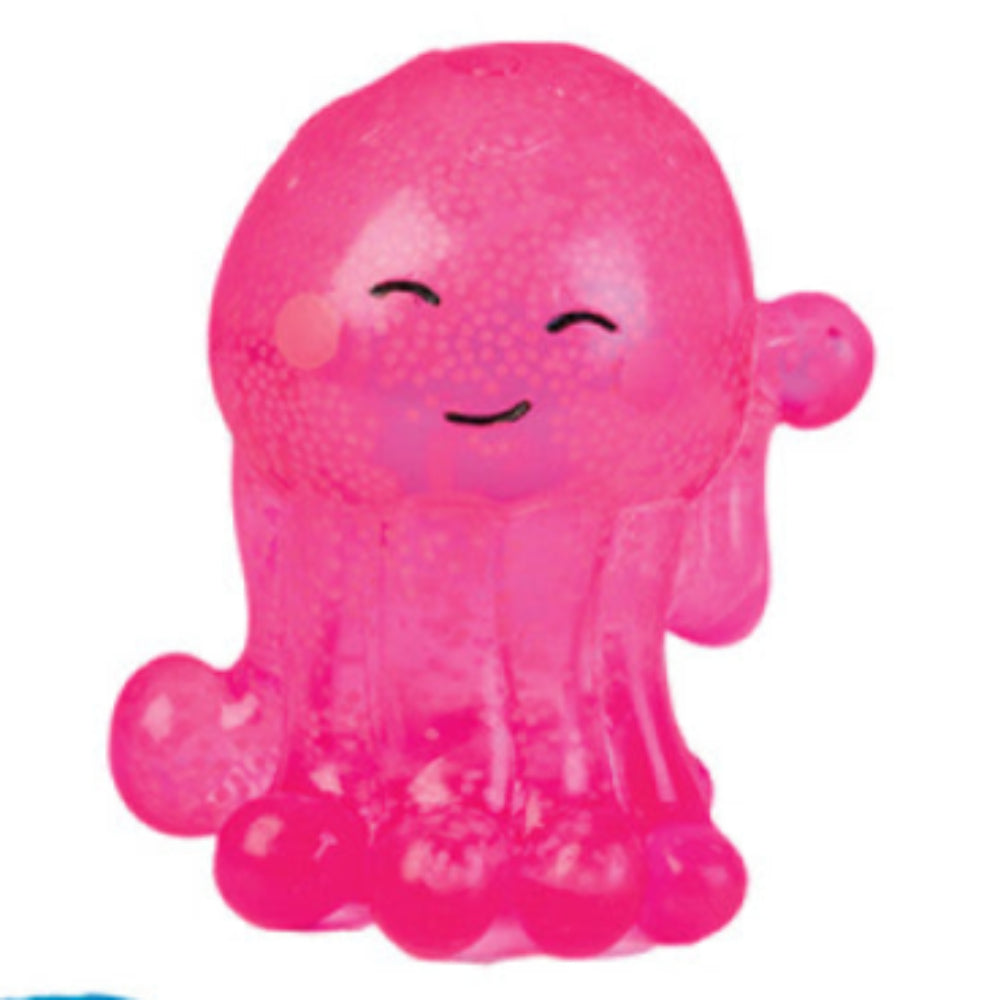 Smiling pink, translucent blob stress toy with a granular texture