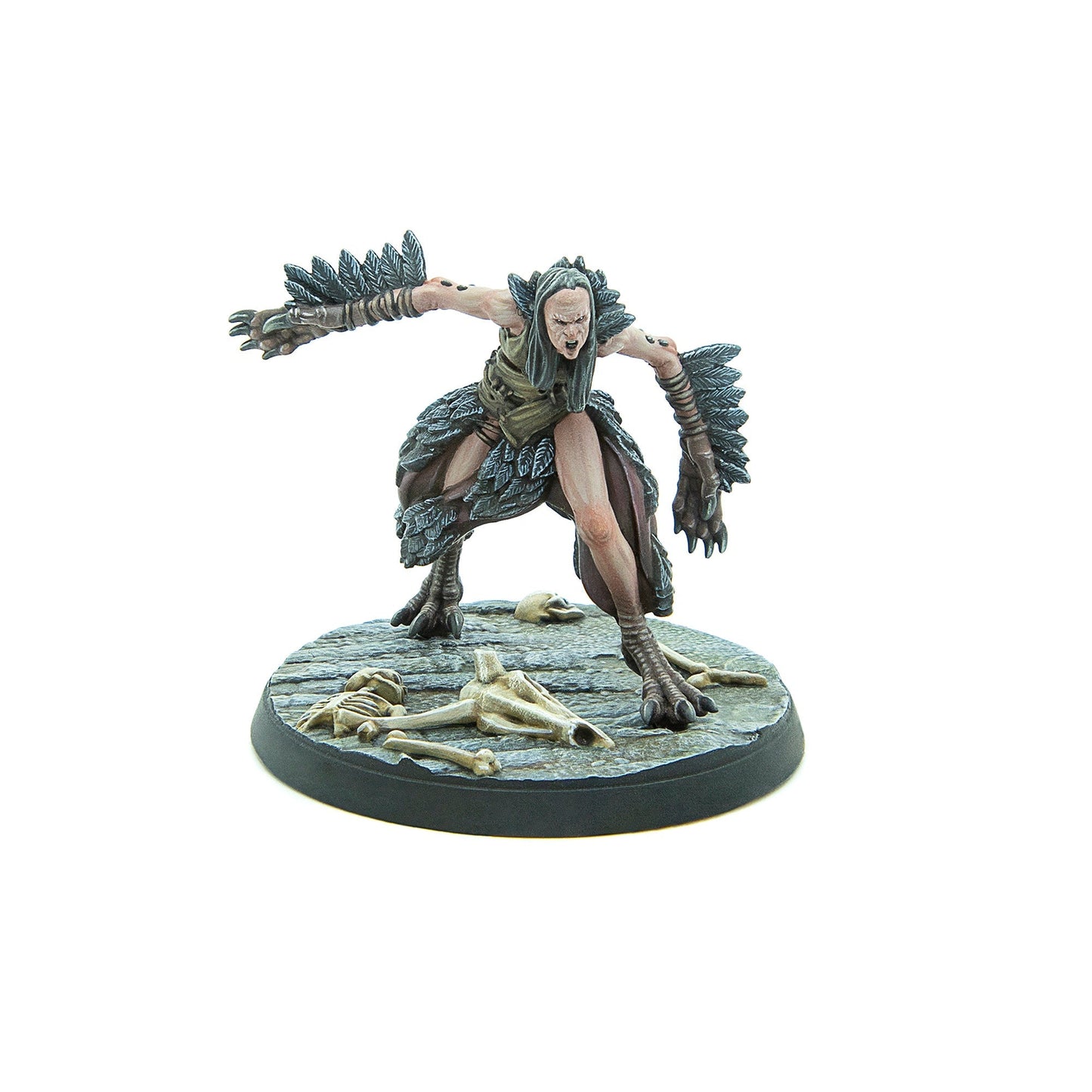 Screaming harpy miniature with outstretched, feathered arms and taloned feet, standing on a base with skulls