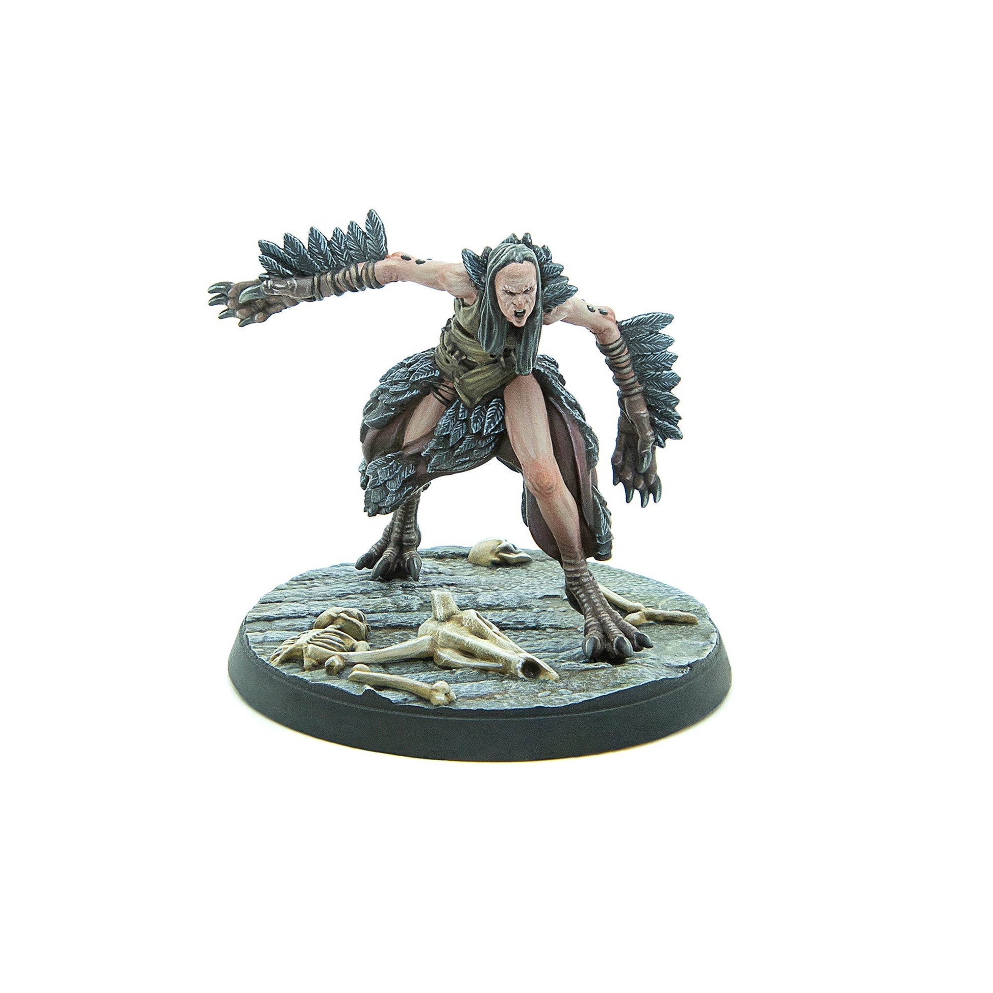 Screaming harpy miniature with outstretched, feathered arms and taloned feet, standing on a base with skulls
