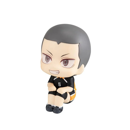Chibi style figure wearing a black volleyball uniform (number 5), sitting with knees up and a confident smile