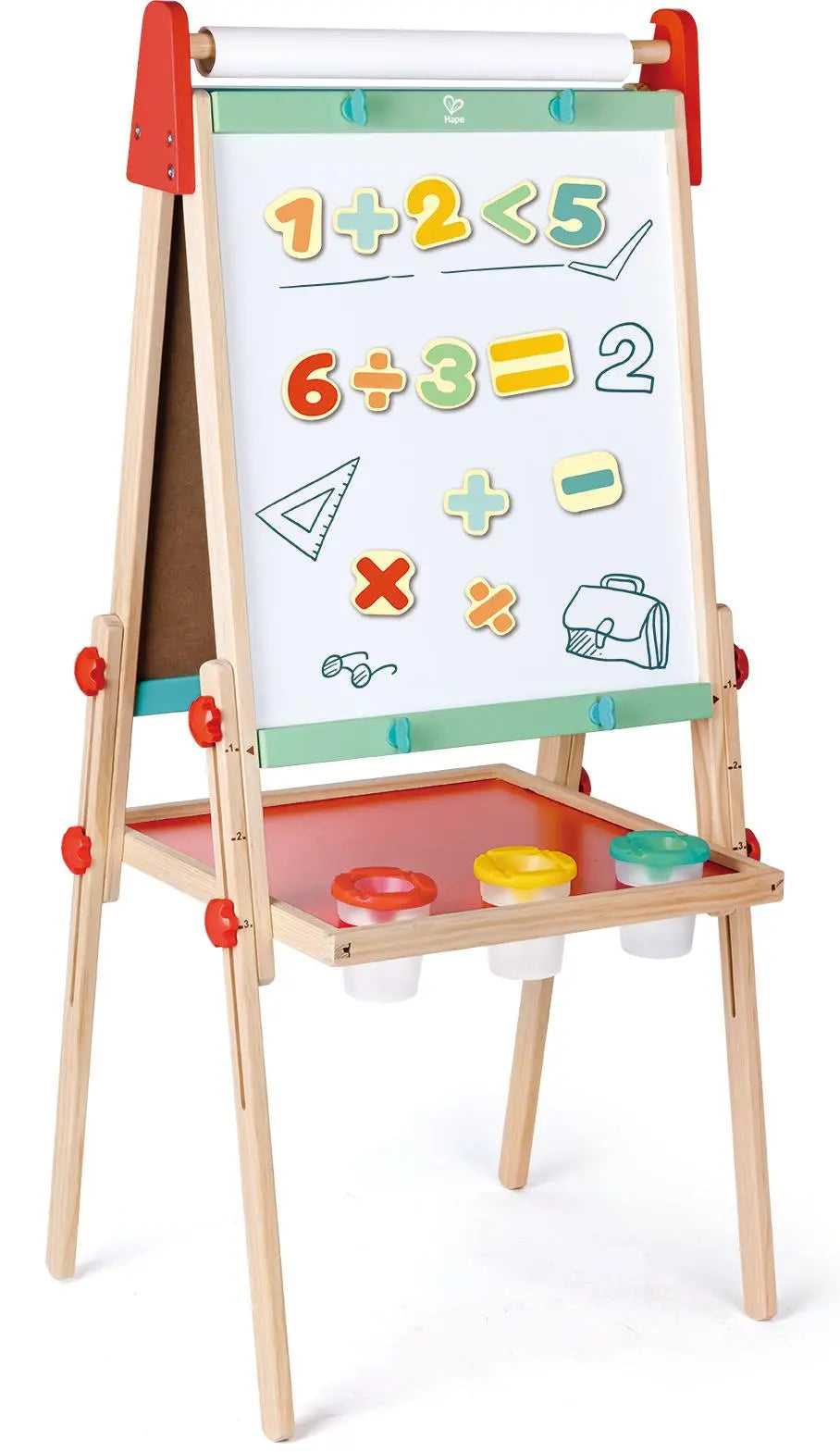 A child's wooden easel with a whiteboard showing magnetic math problems, numbers, and symbols, plus a red tray with three paint pots.