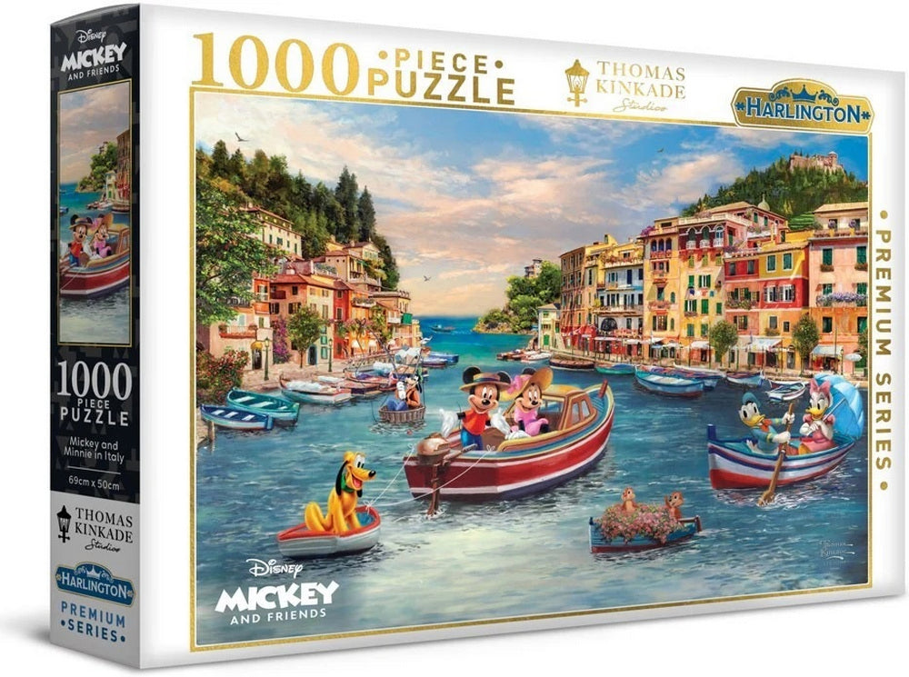 A Disney puzzle box shows Mickey, Minnie, and friends boating in a vibrant, colorful Italian-style harbor town