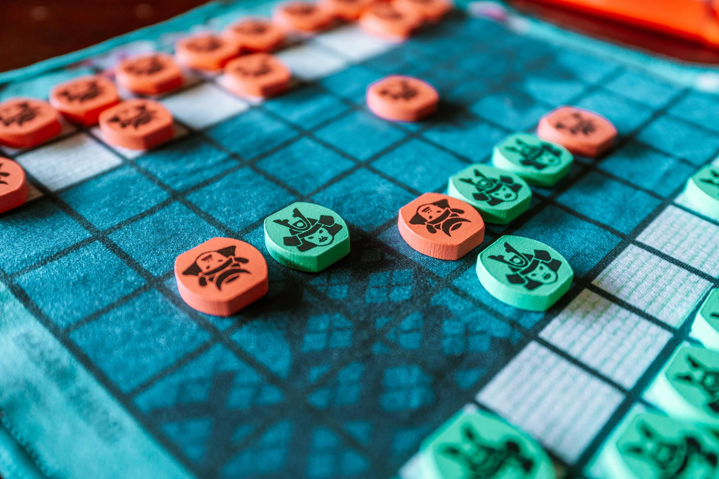 Close-up of Hasami Shogi game board and black-and-white game pieces
