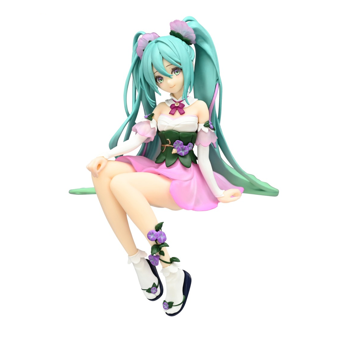 Hatsune Miku anime figure sitting, in a green leafy bodice, pink skirt, with aqua pigtails and purple flowers