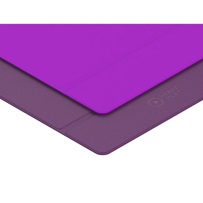 Two-tone purple mat: a bright purple top layer partially covers a darker, textured bottom layer with a "HEAVY PLAY" logo