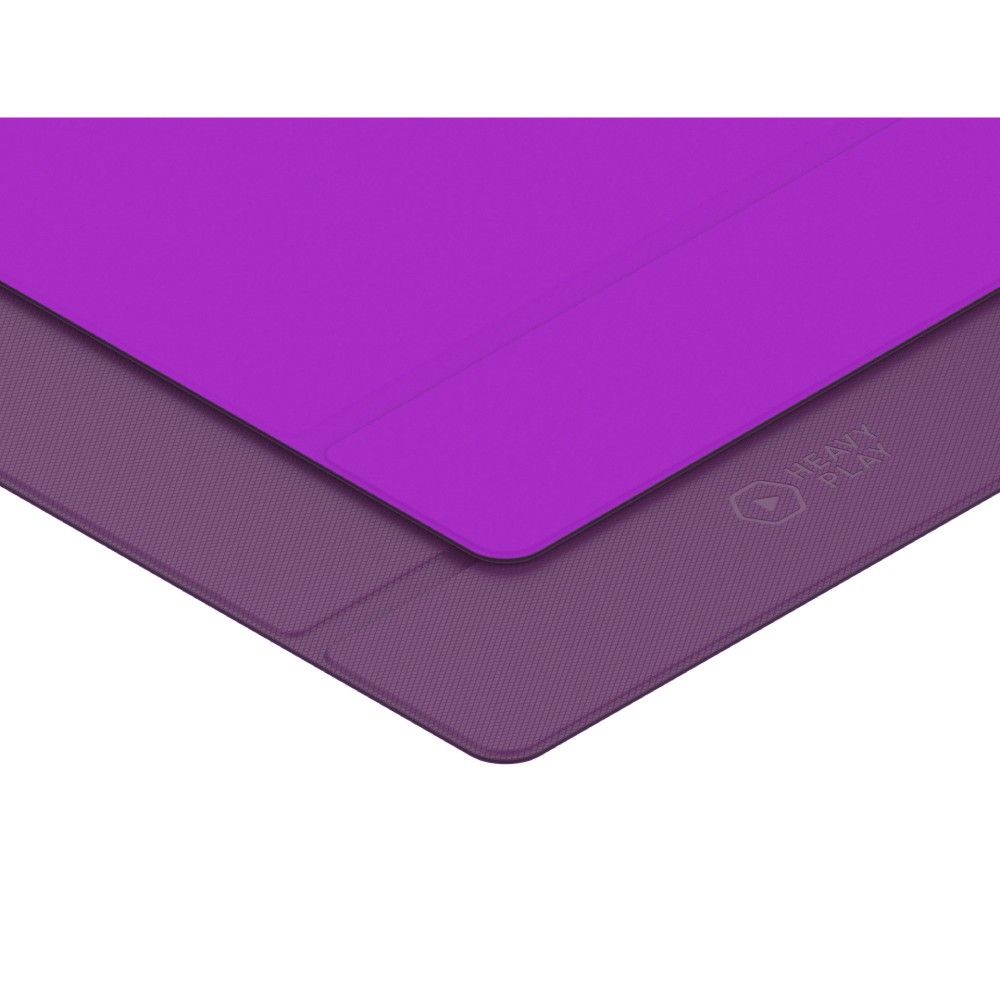 Two-tone purple mat: a bright purple top layer partially covers a darker, textured bottom layer with a &quot;HEAVY PLAY&quot; logo