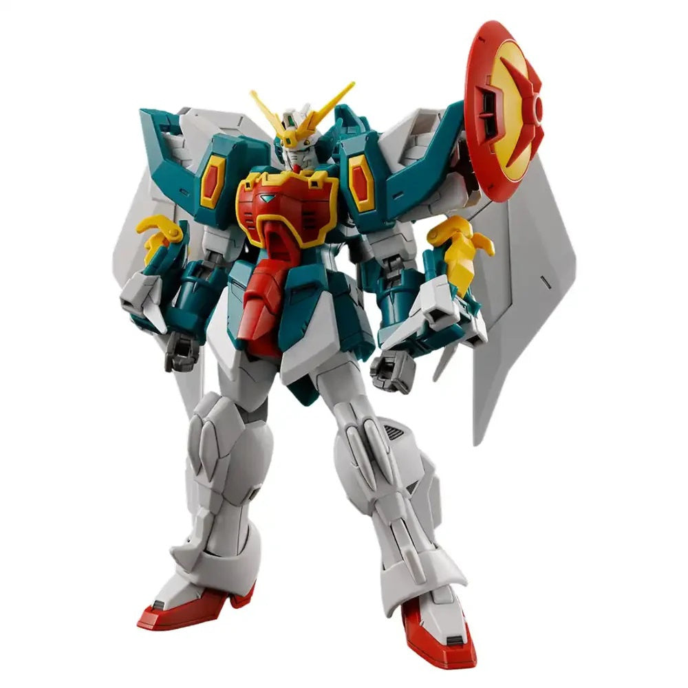 A teal, red, and white Gundam model with large white wings and a red shield, standing upright