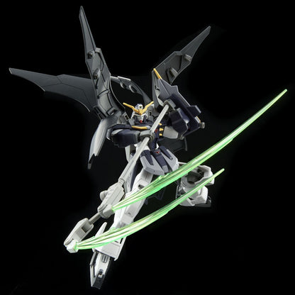 A dark gray, white, and yellow Gundam with large wings wields a staff with two glowing green energy blades
