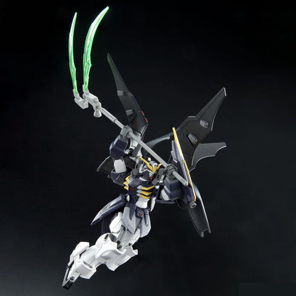 Dark blue, white, yellow Gundam model dynamically posed, wielding a staff with glowing green scythe blades. Large black wings on its back
