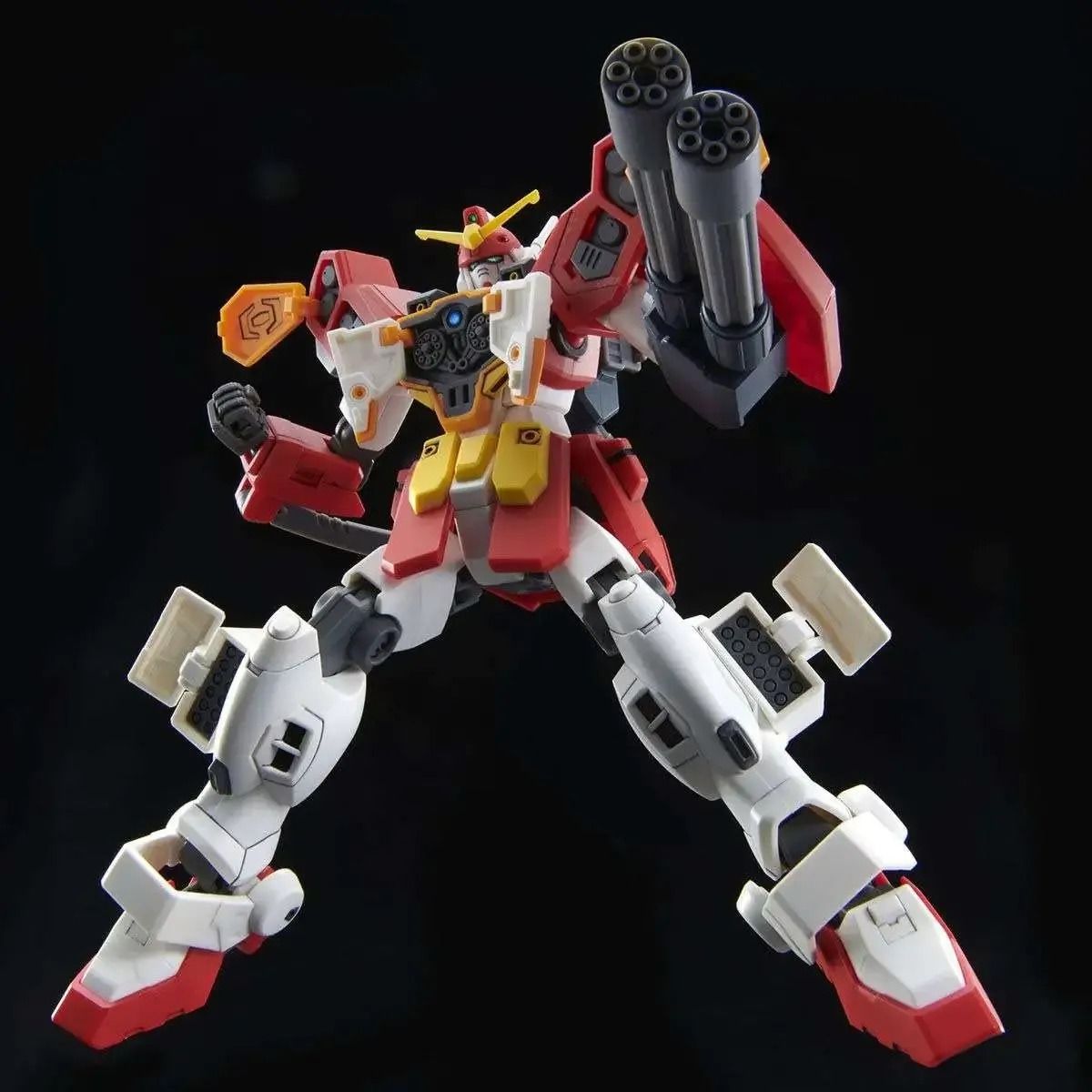 Red, white, and yellow Gundam model with twin shoulder gatling guns and a hip sword, striking a dynamic pose