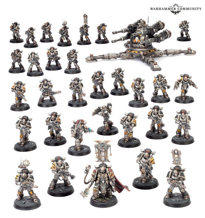 A collection of painted Warhammer Space Marine miniatures in grey and yellow/black, with a large triple-barreled cannon