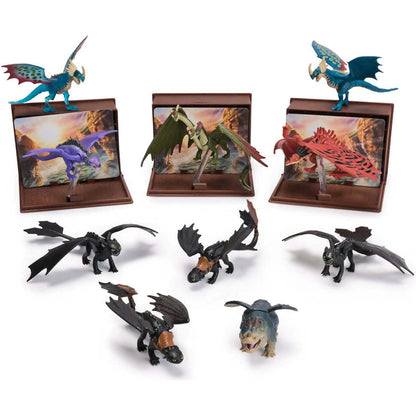Eleven How to Train Your Dragon toy figures, including Toothless, Stormfly, Hookfang, Meatlug, Light Fury, and Rumblehorn, three are on display stands with scenic backgrounds