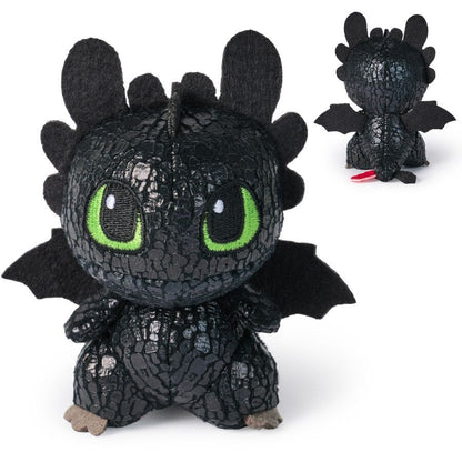 Black Toothless dragon plush toy with green eyes and scaly texture, shown from front and back with red tail fin