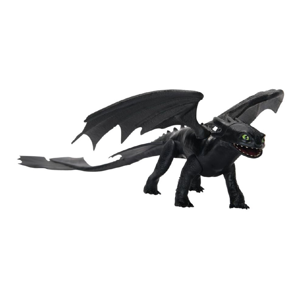 Black Toothless dragon toy with large wings, green eyes, and long tail, standing on a white background