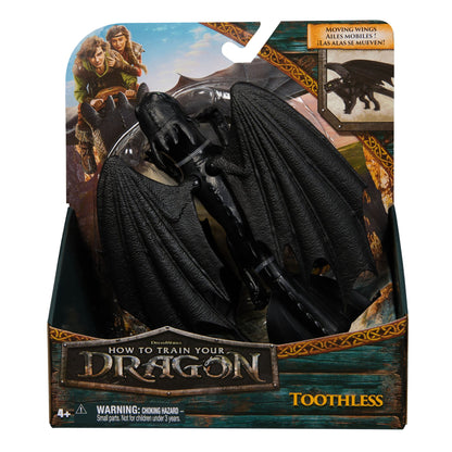 Black Toothless dragon action figure with large wings in "How to Train Your Dragon" packaging, box shows Hiccup, Astrid, and "Moving Wings" feature