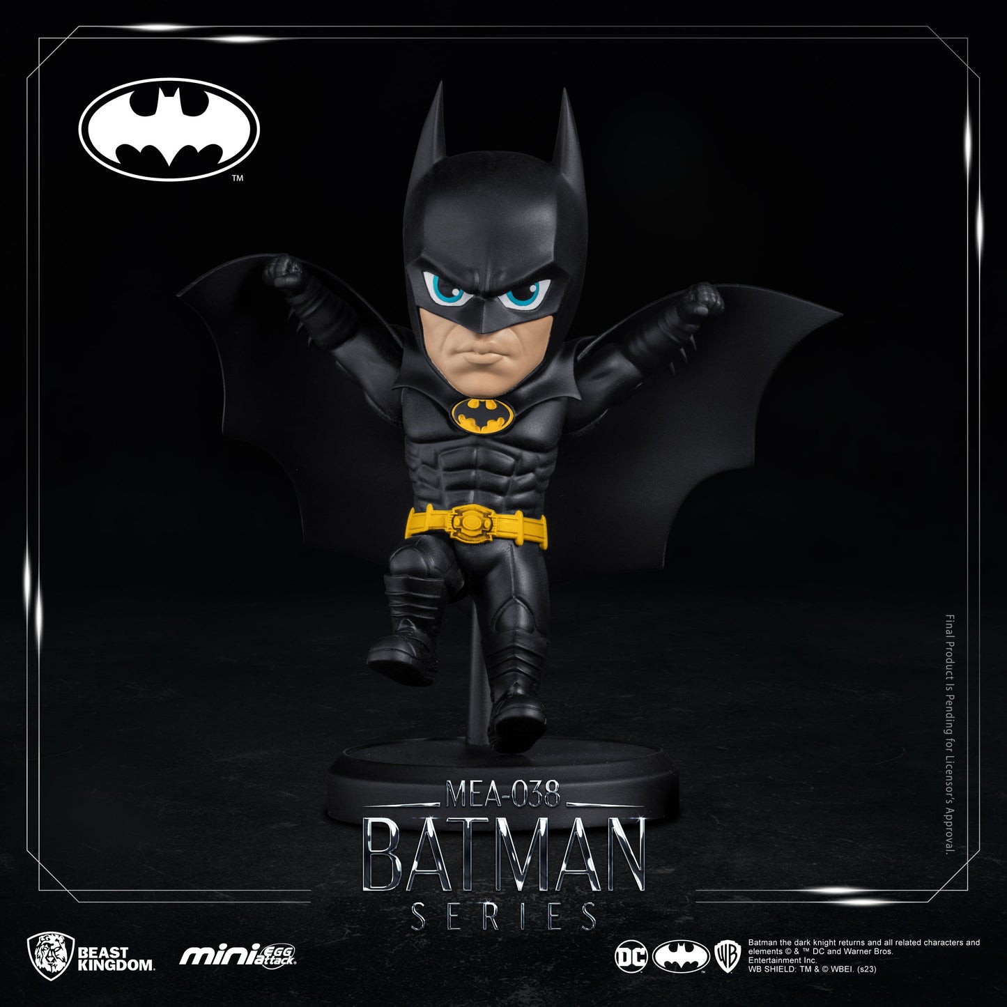 Batman figure holding gadget, displayed on black round base