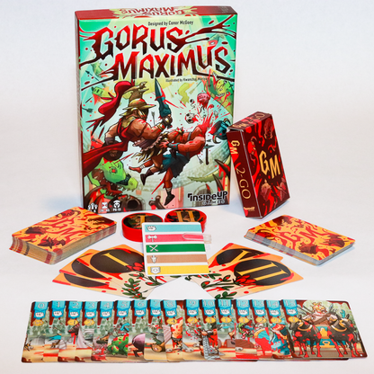 Gorus Maximus board game box with violent gladiator art, alongside cards, tokens and a small 'GM 2-GO' box