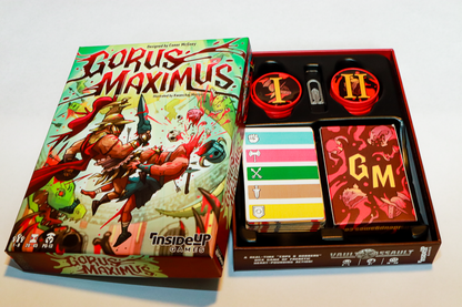 An open "Gorus Maximus" board game box, displaying gory cover art, game cards, and red numbered tokens