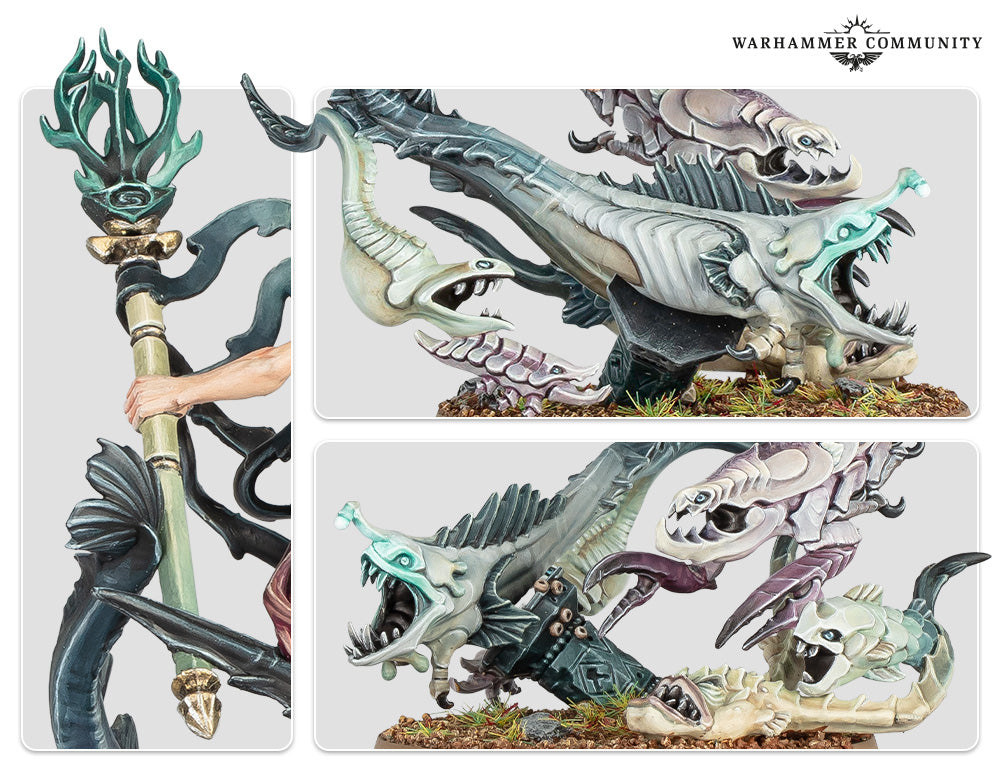 Warhammer miniature: Hand holds a staff beside several grotesque, sharp-toothed, multi-colored fish-like monsters on a base