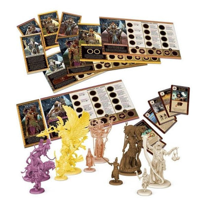 Ankh Gods of Egypt board game components featuring rulebooks character cards player boards and detailed miniature figures in yellow purple bronze and light tan resin