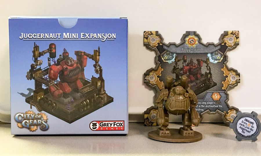 City of Gears Juggernaut Mini Expansion box next to the Juggernaut mini figure and card