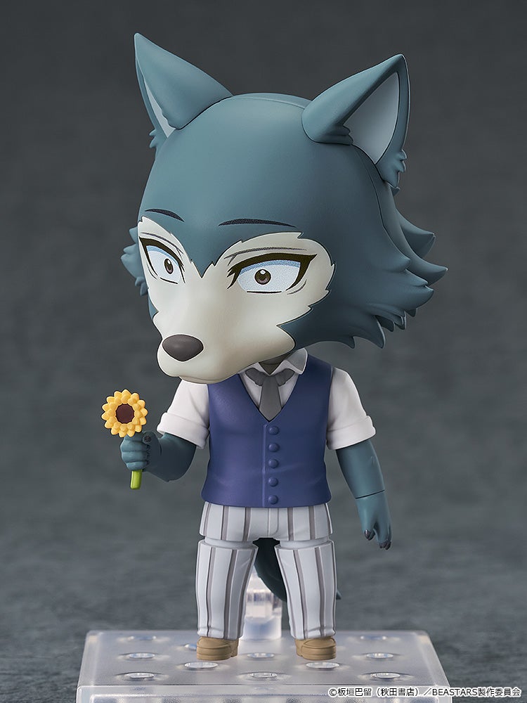 Nendoroid figure of Legoshi, the grey wolf, in a blue vest and striped pants, holding a sunflower