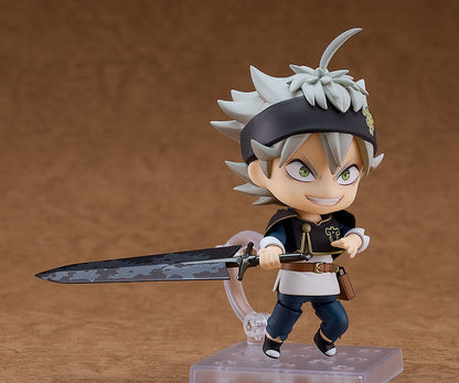 Nendoroid Asta figure with gray spiky hair, black headband, grinning as he wields a large black sword