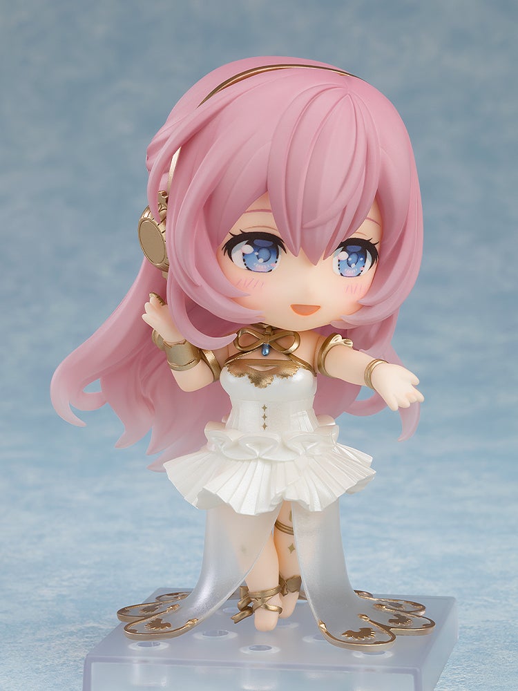 A pink-haired Nendoroid figure in an ornate white and gold dress, blue eyes, smiling with arms slightly raised