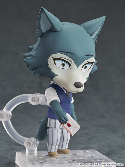Nendoroid Legoshi figure, a blue-gray wolf in a vest, holds a white envelope with a red heart seal