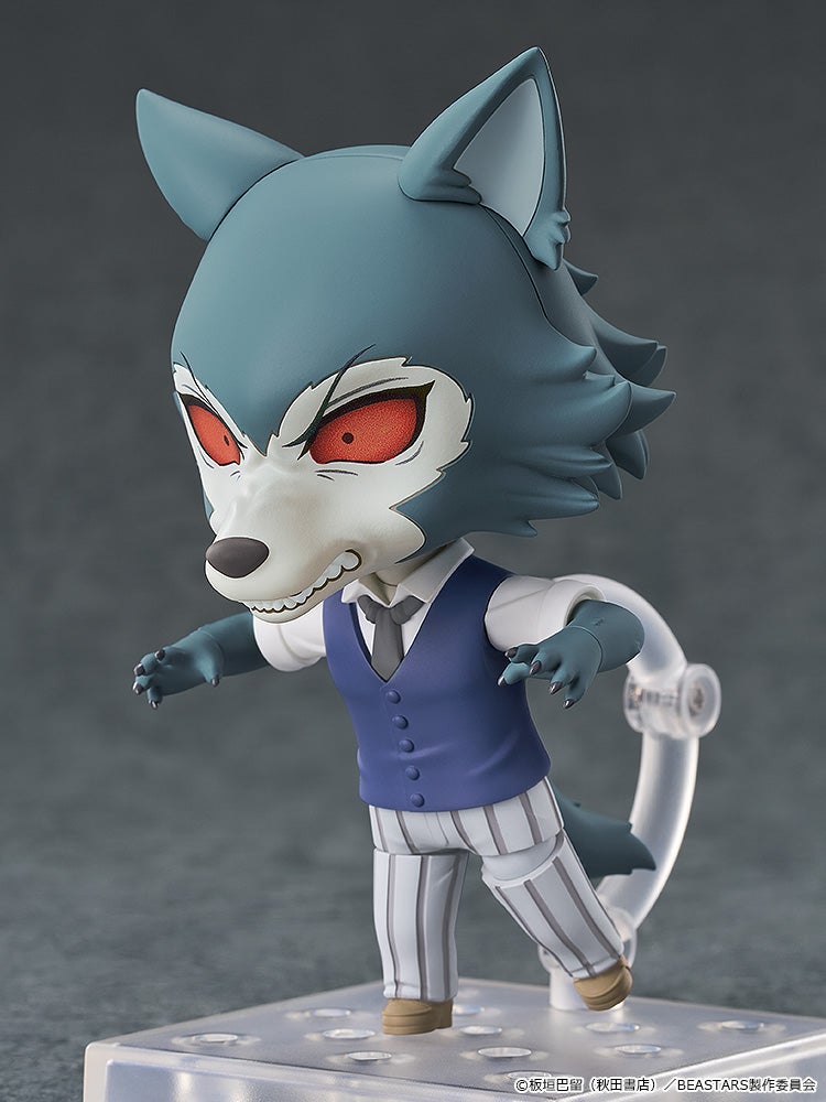 A gray wolf chibi figure with red eyes and bared teeth, dressed in a blue vest, striking a menacing pose