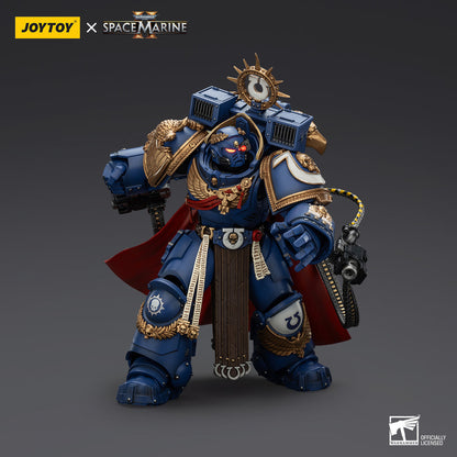 Detailed Ultramarines Space Marine action figure in blue power armor, red cape, glowing eyes, and a chain weapon