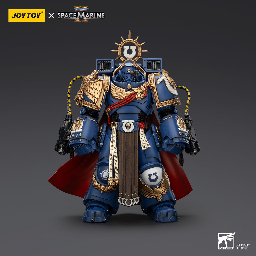 Blue Ultramarines Space Marine action figure in gold-trimmed power armor, wearing a red cape and holding two guns