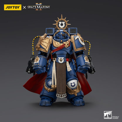 Blue Ultramarines Space Marine action figure in gold-trimmed power armor, wearing a red cape and holding two guns