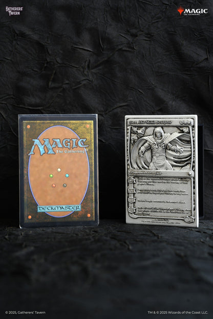 Magic: The Gathering card back in a sleeve and a metal Jace, the Mind Sculptor Planeswalker plaque on dark fabric