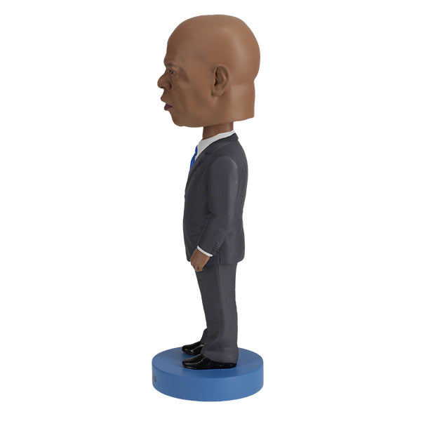 Royal Bobbles John Lewis bobblehead in a grey suit and blue tie side view