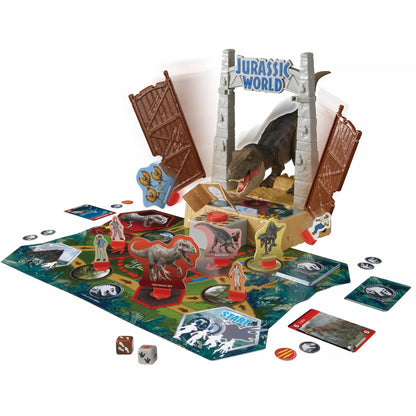 Jurassic World board game: A T-Rex bursts through a gate on a jungle map, surrounded by dinosaur and human pawns, cards, and dice