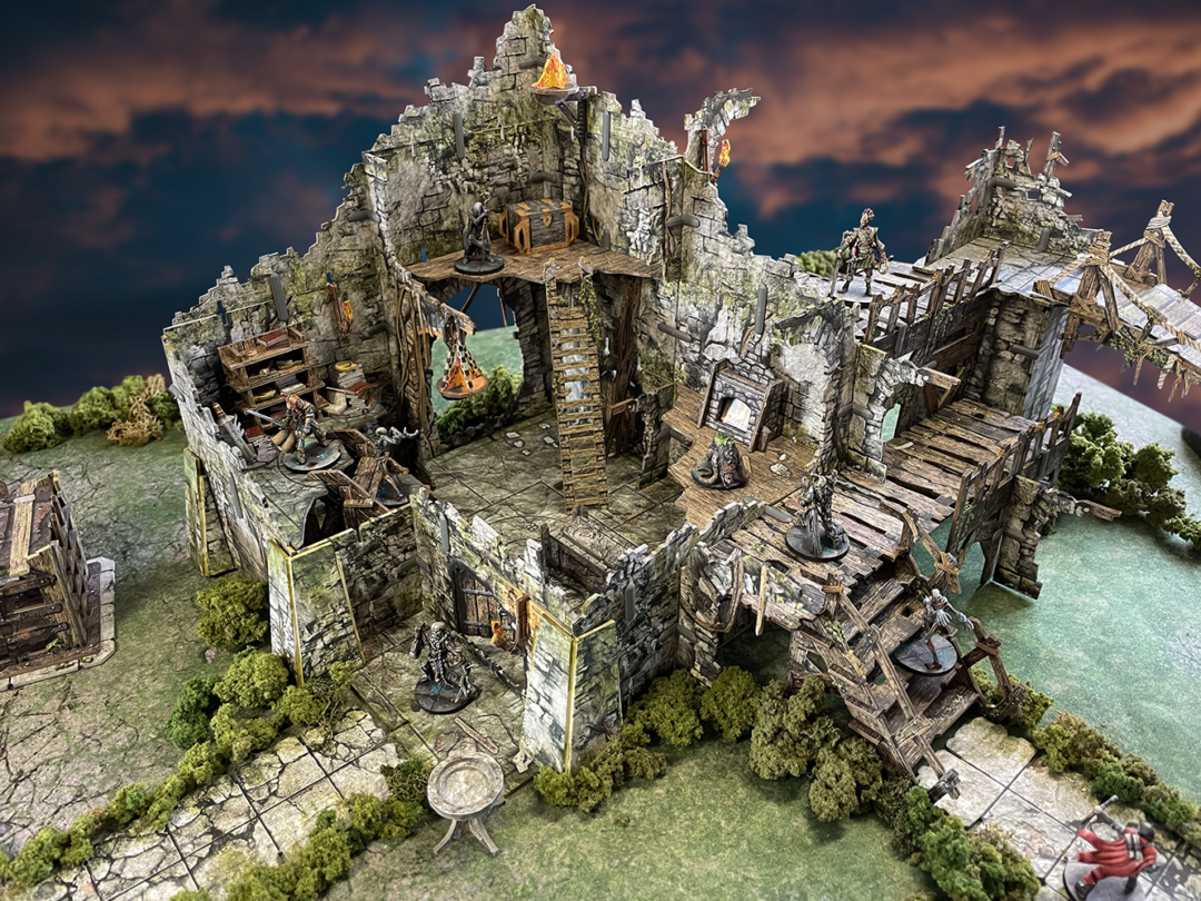 Battle Systems Crypts and Caverns Dungeon Upgrade Pack showcasing multi-level modular stone ruins with wooden platforms ladders and miniature figures on a green terrain mat