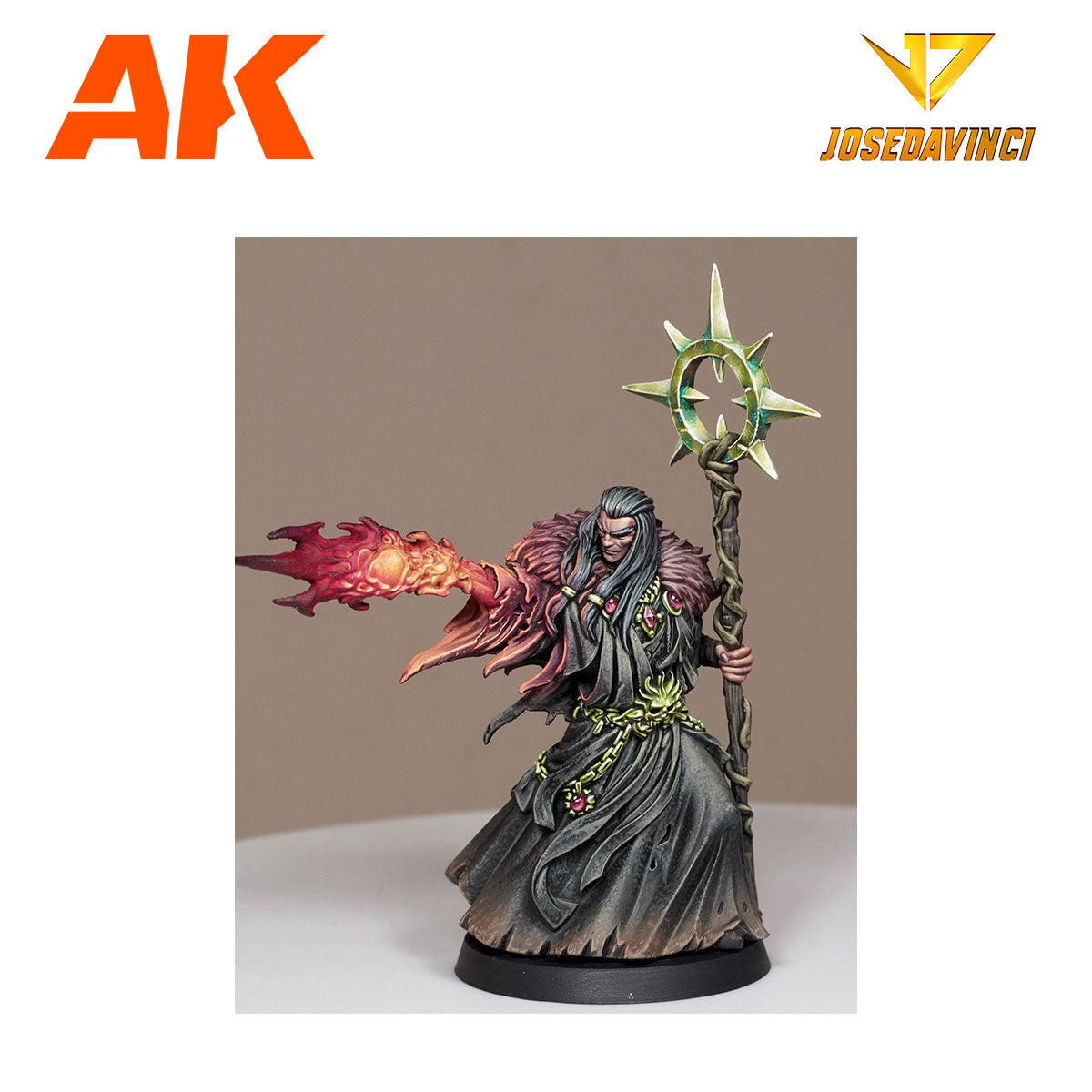 Painted miniature of a wizard in dark robes, casting a fiery spell from one hand and holding a star-topped staff