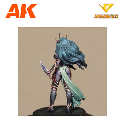 Back view of a painted miniature horned female warrior with flowing teal hair, dark armor, and a dagger