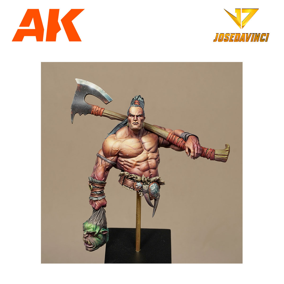Detailed miniature bust of a muscular warrior holding an axe over his shoulder and a severed green orc head