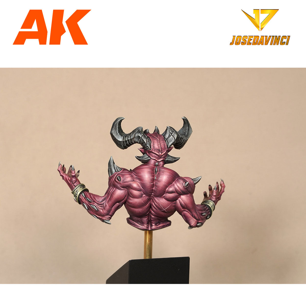 Painted miniature bust of a horned red demon with a muscular, spiked back and outstretched clawed arms on a stand