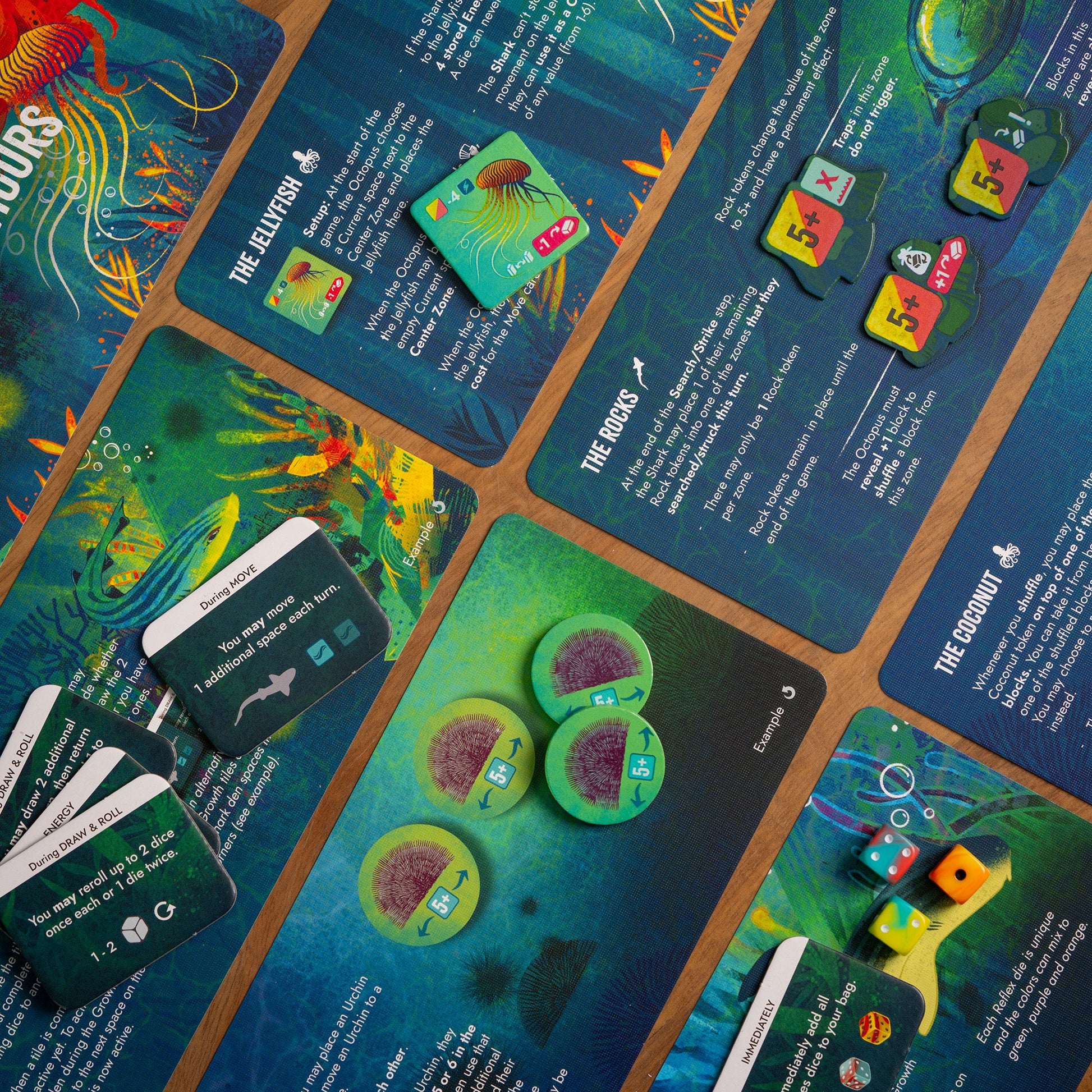 Vibrant cards and tokens for an underwater-themed strategy board game, including custom dice, rock tokens, and green urchin counters