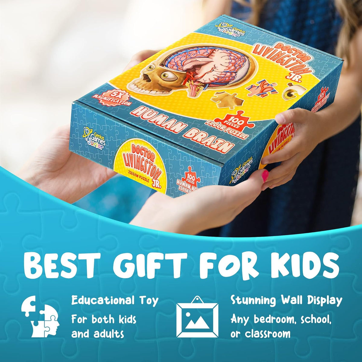 Child&#39;s hands display a &quot;Doctor Livingston Jr. Human Brain&quot; 100-piece floor puzzle box