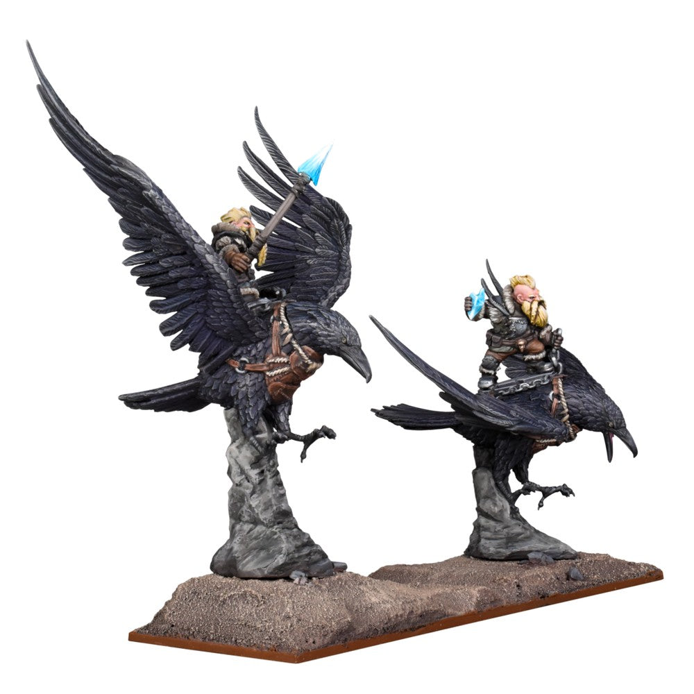Two bearded fantasy warriors riding large black ravens one raven has wings spread, its rider holds a glowing blue axe