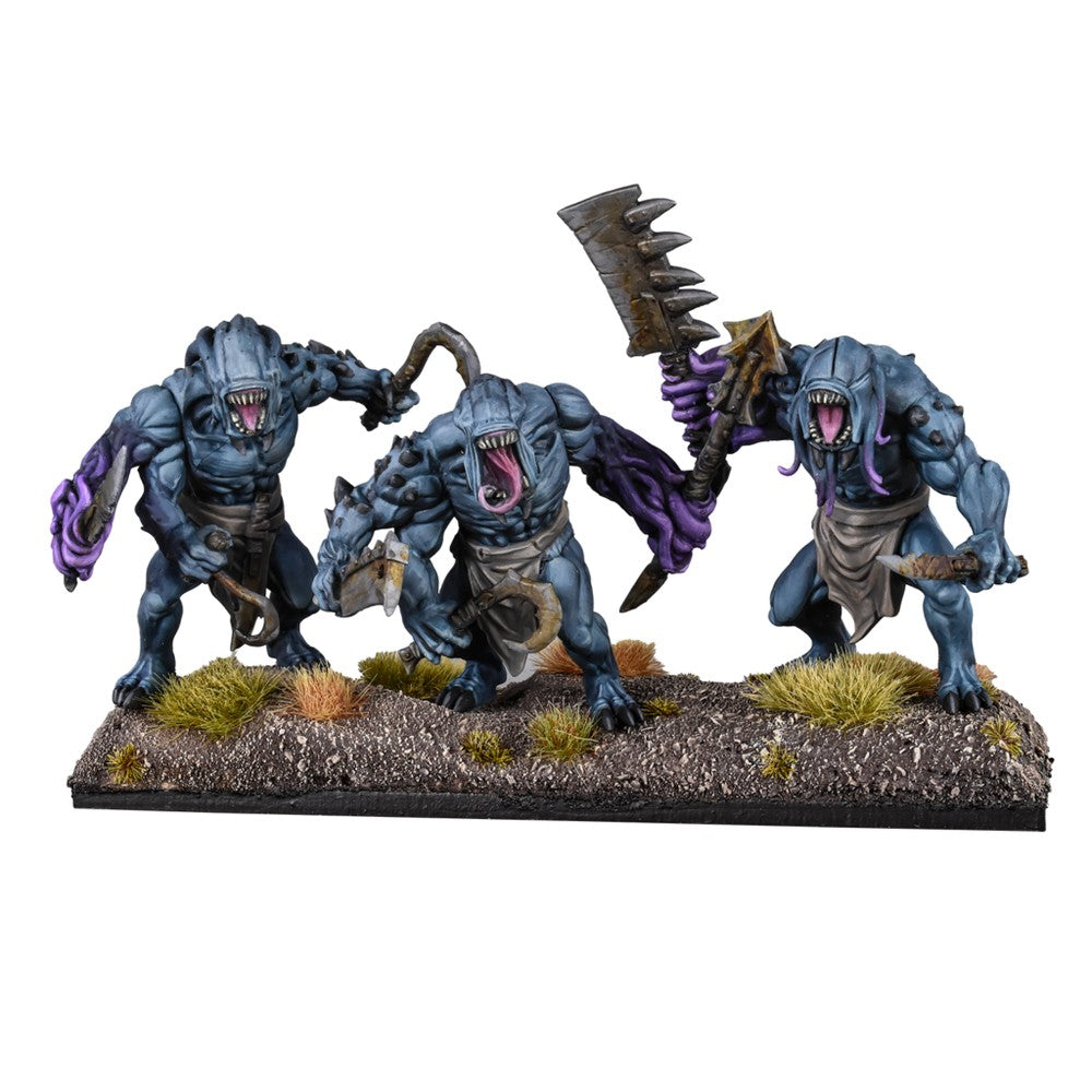 Three blue-grey monster miniatures with sharp teeth and purple mutations, wielding cleavers and hooks, on a textured base