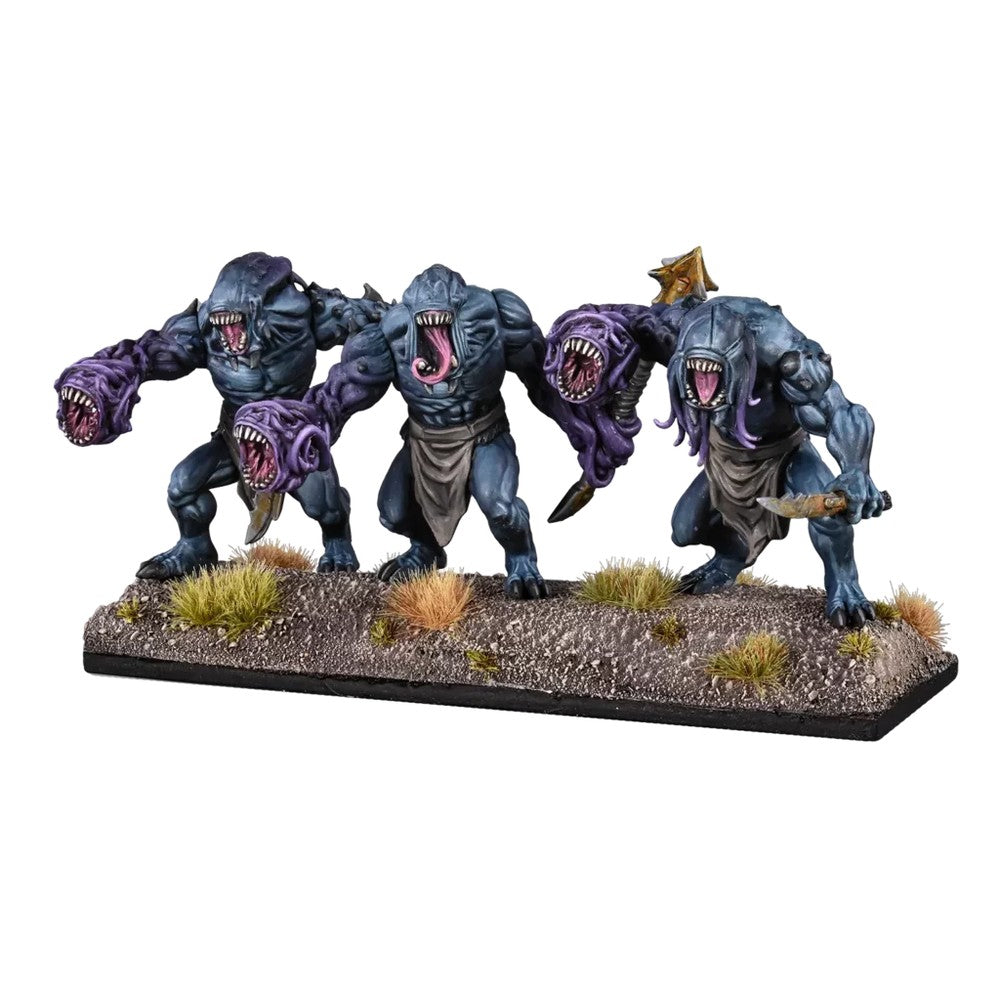 Three grotesque blue-grey monster miniatures with purple arm-mouths and sharp teeth, posed aggressively on a base